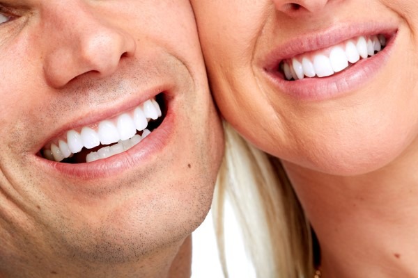 smiling couple with porcelain veneers in hoover al and bessemer al
